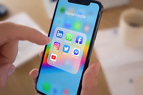 Audience engagement analytics and mobile social content on a bright desk